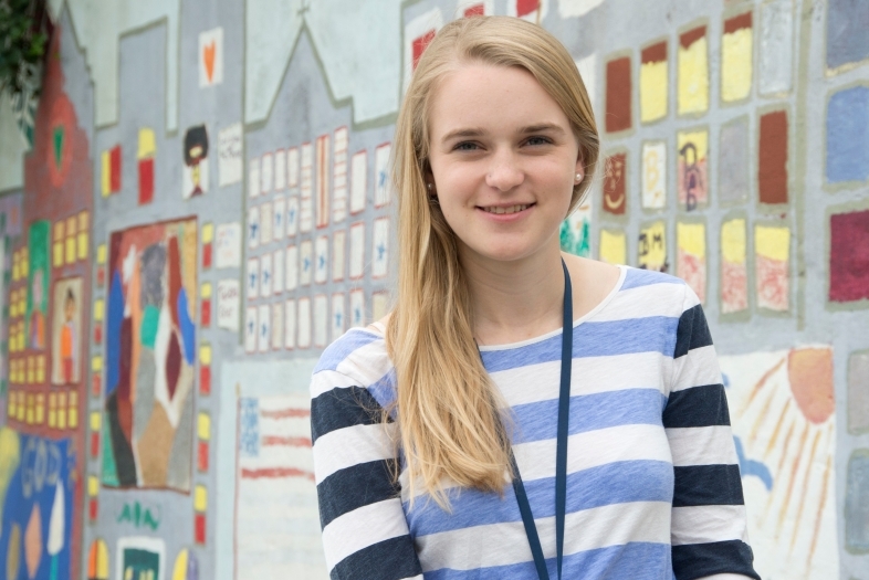 Davidson Stapleton student poses by painted wall