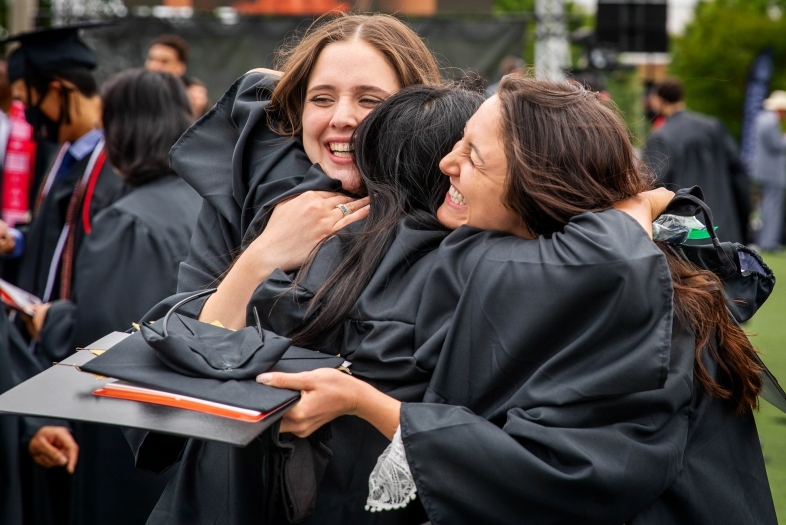 Students Hugging at Commencement
