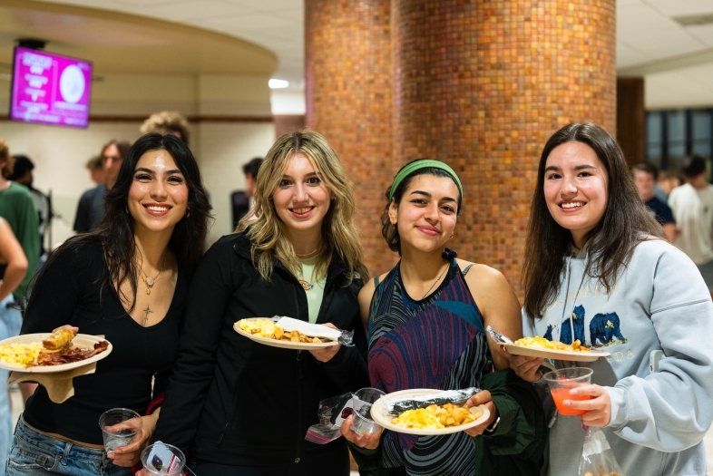 Dining Services four students in holding plate in Vail Commons