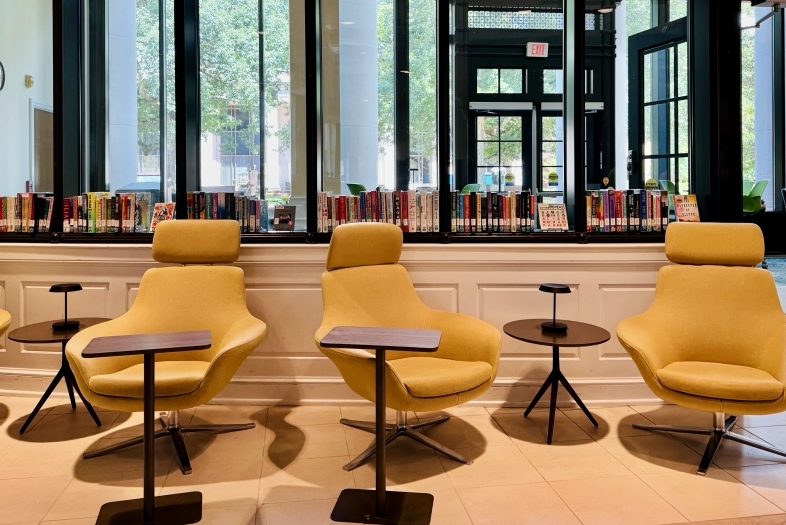 Yellow chairs in the Temporary Library space in Lilly Gallery