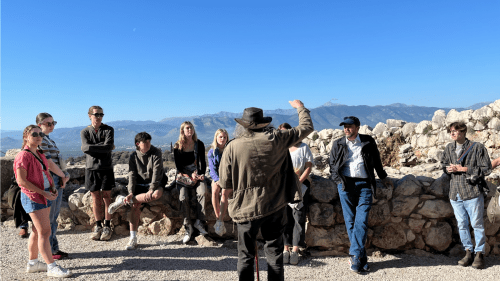 Professor Emeritus Michael Toumazou lectures Davidson students atop the Mycenaean ruins.