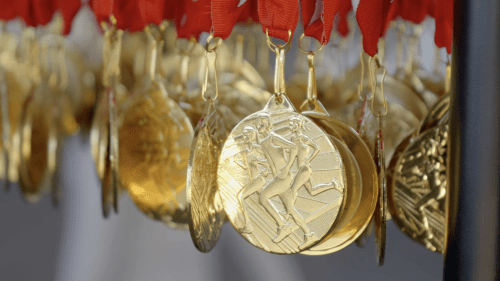 a collection of gold olympic medals