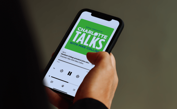 Charlotte Talks podcast playing on phone screen
