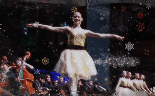 2026 Holiday Video Still Ballerina on stage with orchestra to the side
