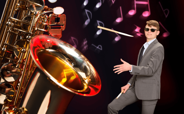 A giant saxophone and student with a drumstick