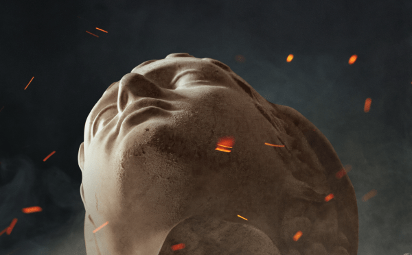 Close-up, low-angle view of a stone classical bust tilted backward against a dark, smoky background with floating orange embers