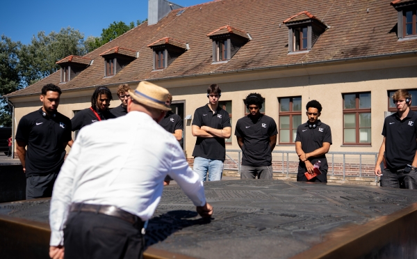 Davidson College Basketball team visits the Sachsenhausen concentration camp.