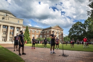 Social Justice Event - Football Team on the Green