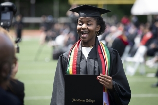 2021 Commencement Student Receives Diploma