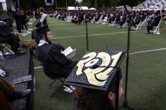 2021 Commencement Students at Graduation and with 2021 Cap