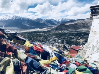Buddhist flags overlooking mountains in Leh, India 