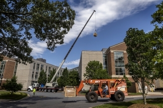 Davidson greenhouse construction ground view with construction truck and raised lever