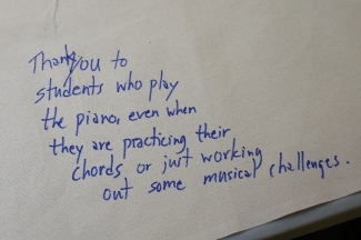 A thank you note that reads "Thank you to students who play the piano even when they are practicing their chords or just working out some musical challenges."