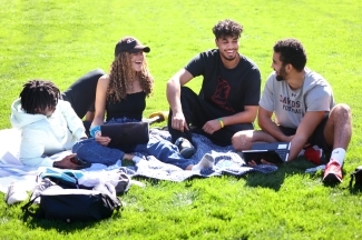 Admission Welcome -- Students Laughing on the green