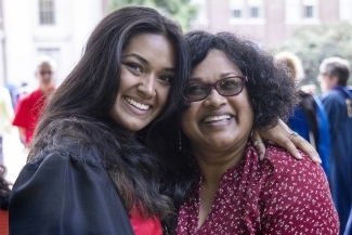 Graduate with family member at Class of 2022 Commencement