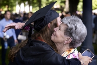 Graduate hugging family member at Class of 2022 Commencement