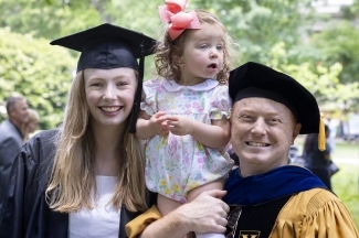 Madeline Buitendorp, Chris Marsicano and child posing for picture at Class of 2022 Commencement