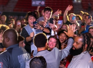 Curry greeting students during Curry for 3 Event