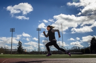 Student running on track
