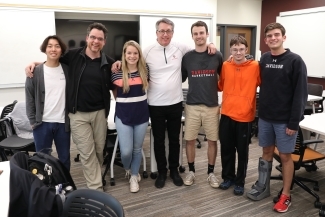 Students standing together smiling