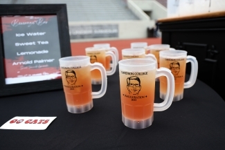 Doug mugs filled with iced tea on a black table