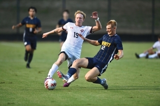 #16 on men's soccer team playing soccer