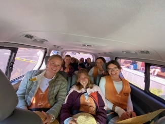 a group of students in a van together