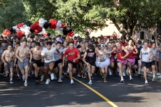 a group of young men run