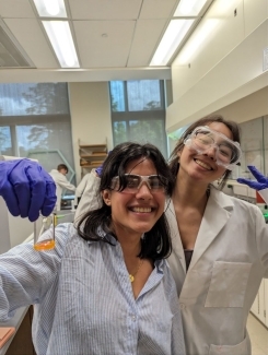 Ruby Zhou and Maya Vermeer proud and showing off their synthesized fluorescent polymer precursor