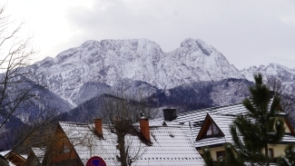 a series of mountains on a snow day
