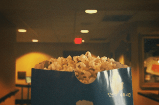 a bag of popcorn in a movie auditorium
