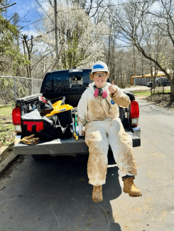Caitlin Stehn ’24 on the back of a truck