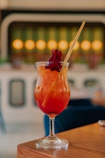 a fruity cocktail in a fancy restaurant