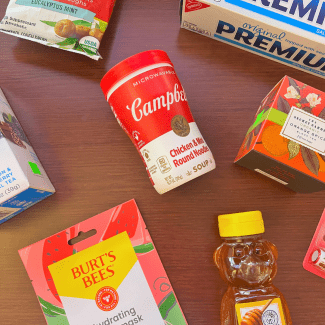 a table covered with soup, chap stick, honey and tea