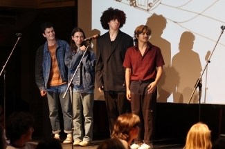 a group of young people on a stage doing improv
