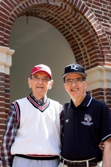 Bill and Will DuBose stand outside with their Davidson branded shirts