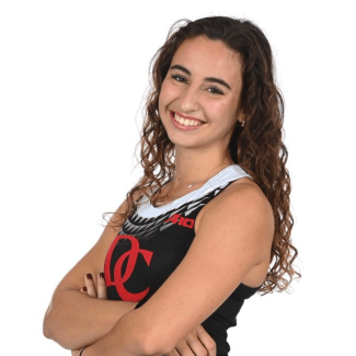 a young woman wearing a Davidson College track uniform with long curly dark hair