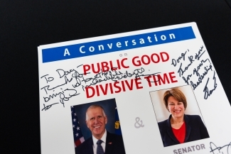 Poster signed by S. Senators Thom Tillis and Amy Klobuchar when they visited Davidson College 