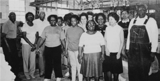 Black and white group photo of laundry staff