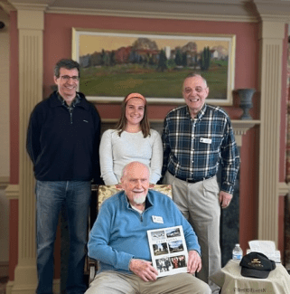  Davidson College student Abby Murphy is joined by Prof. John Wertheimer (l), Gen. Carlton Fulford Jr. (r) and Prof. Emeritus Sam Maloney ’48 (seated).