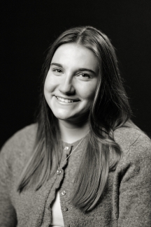 Black and white image of college-age woman with long dark hair