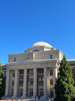 a large collegiate building on a sunny day