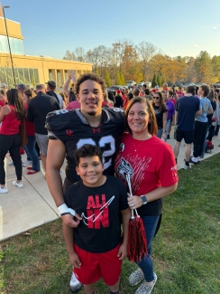 Zavier Pollard ’29 in football uniform and his family