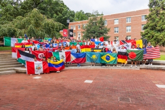 Group of international students holding flags