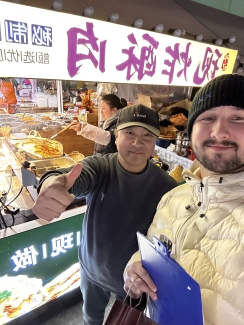 Dean Rusk program with student in Chinese market