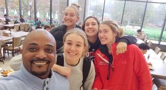 Daniel Heath and members of Davidson's women's basketball team in Vail Commons