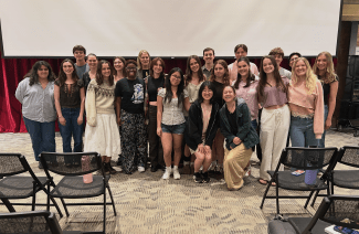A group of students in the 900 room