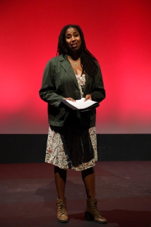Speaker on stage red background
