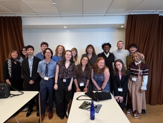 A group of students in a conference room