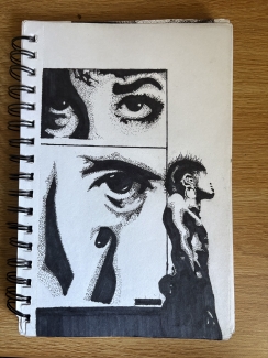 A black pen drawing on white paper of an eye and a human figure